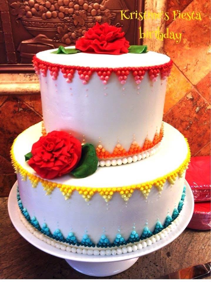 Colorful fiesta themed birthday cake with beaded piping and roses