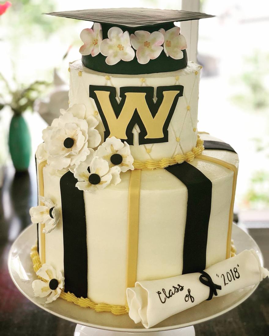 Green gold and white graduation cake with sugar flowers
